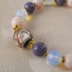 Close-up of the opal and pink chalcedony beads highlighting the natural textures and soft colors.