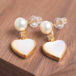 Close-up showing the pearl’s luster and the fine craftsmanship of the heart-shaped design.