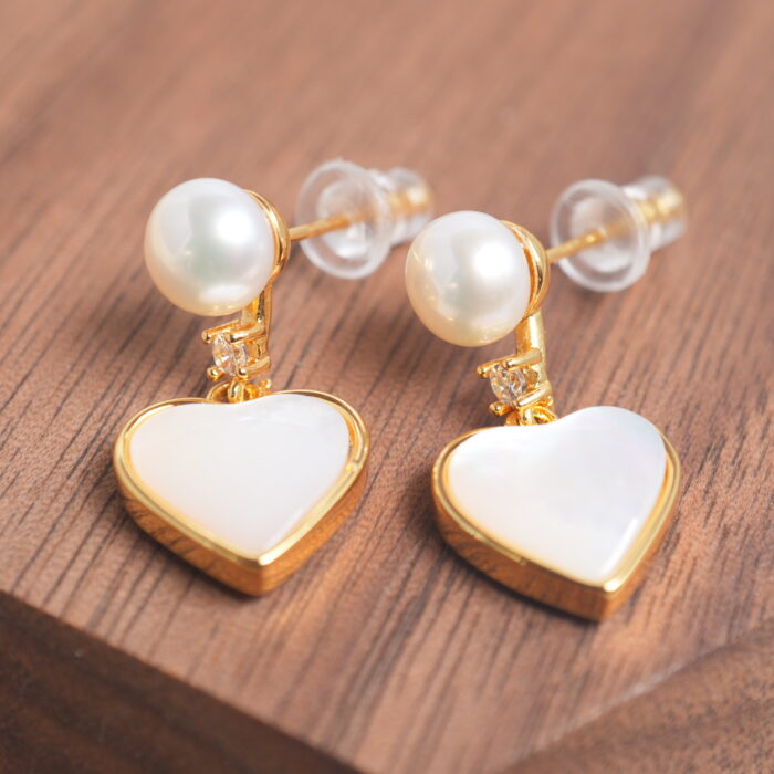 Close-up showing the pearl’s luster and the fine craftsmanship of the heart-shaped design.