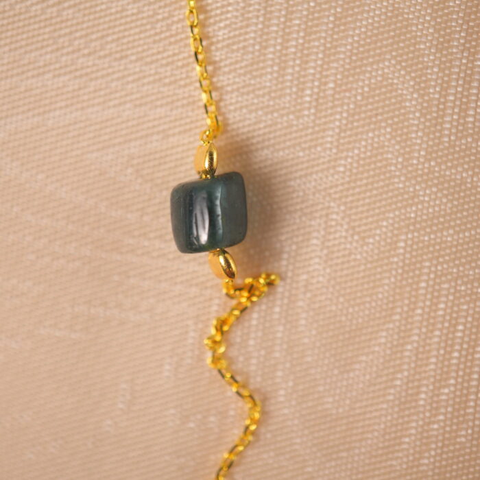 Close-up of colorful tourmaline beads on delicate necklace