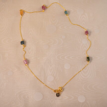 Tourmaline delicate necklace on white background