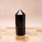 Polished obsidian crystal tower point for grounding and protection