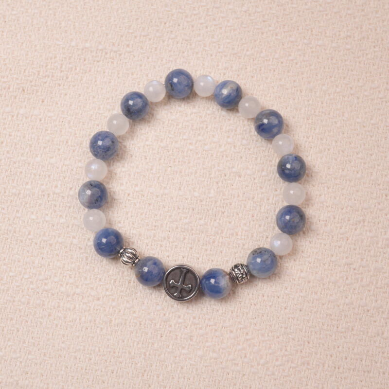 Kyanite and moonstone bracelet with silver accent beads, photographed under soft daylight on a neutral background.