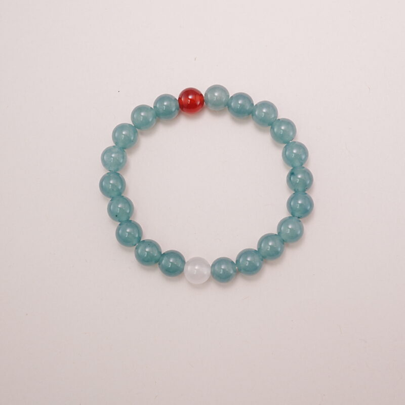 A beautiful Green Aventurine and Red Agate bracelet featuring soothing green tones with a pop of vibrant red. Perfect for calming energy and emotional balance.