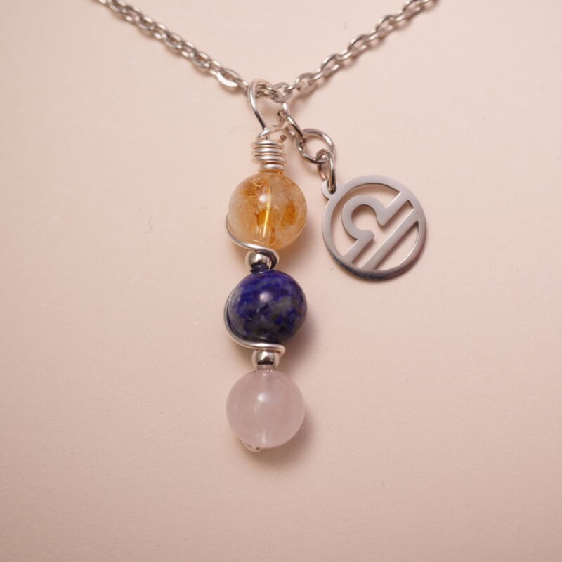 Libra zodiac necklace with citrine, lapis lazuli, and clear quartz gemstones.