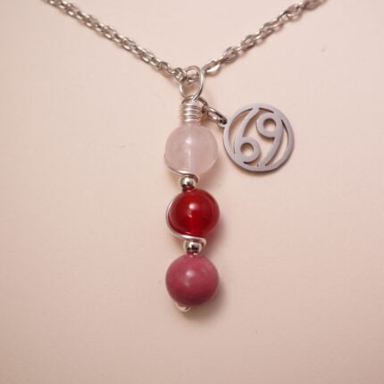 Cancer zodiac necklace with clear quartz, red agate, and rhodochrosite gemstones.