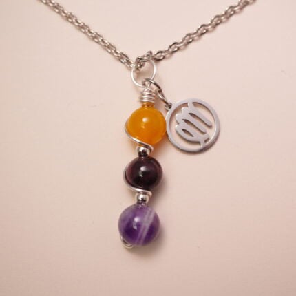 Virgo zodiac necklace with yellow agate, garnet, and amethyst gemstones.