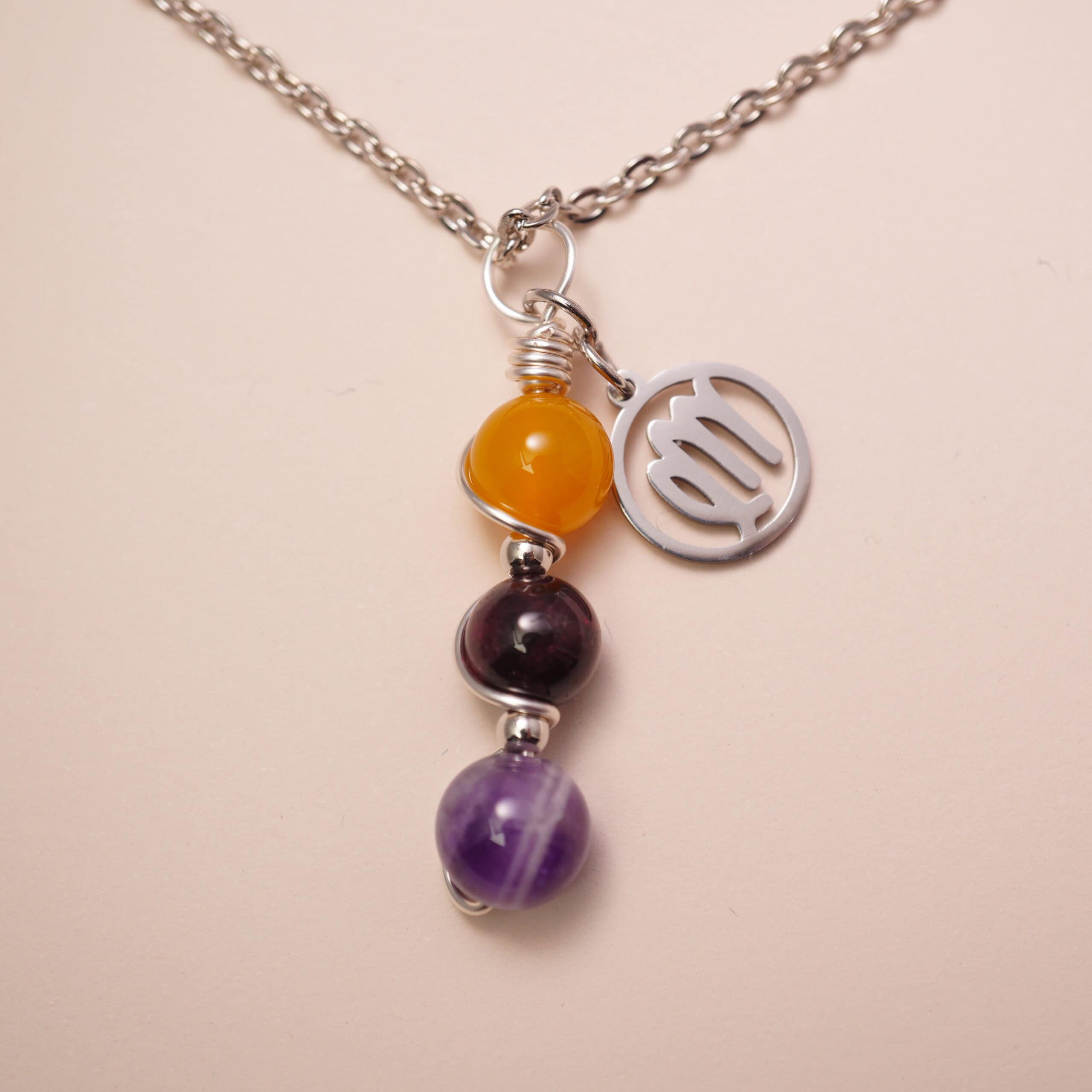 virgo-zodiac-necklace-yellow-agate-garnet-amethyst-main Virgo zodiac necklace with yellow agate, garnet, and amethyst gemstones.