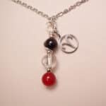 Aries zodiac necklace with amethyst, clear quartz, and red agate gemstones.