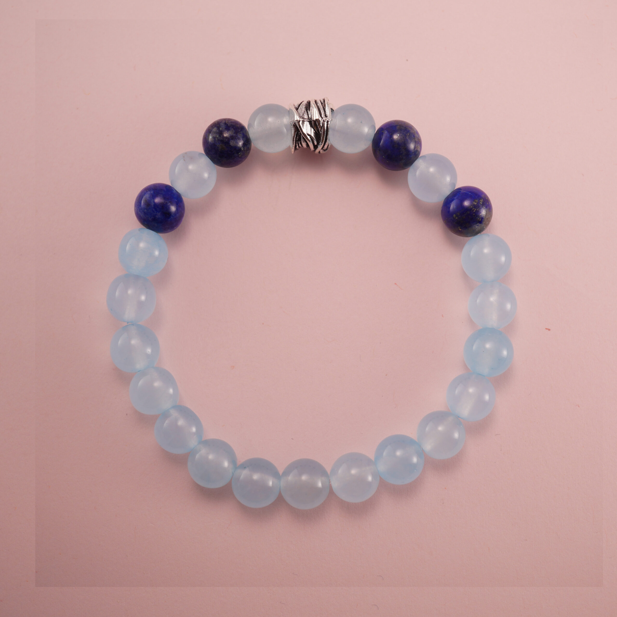 aquamarine-and-lapis-lazuli-bracelet-with-silver-bead Aquamarine and lapis lazuli bracelet with a silver accent bead, photographed under soft daylight.