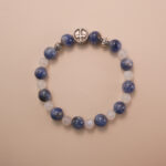 Kyanite and moonstone bracelet with silver accent beads, photographed under soft daylight on a neutral background.