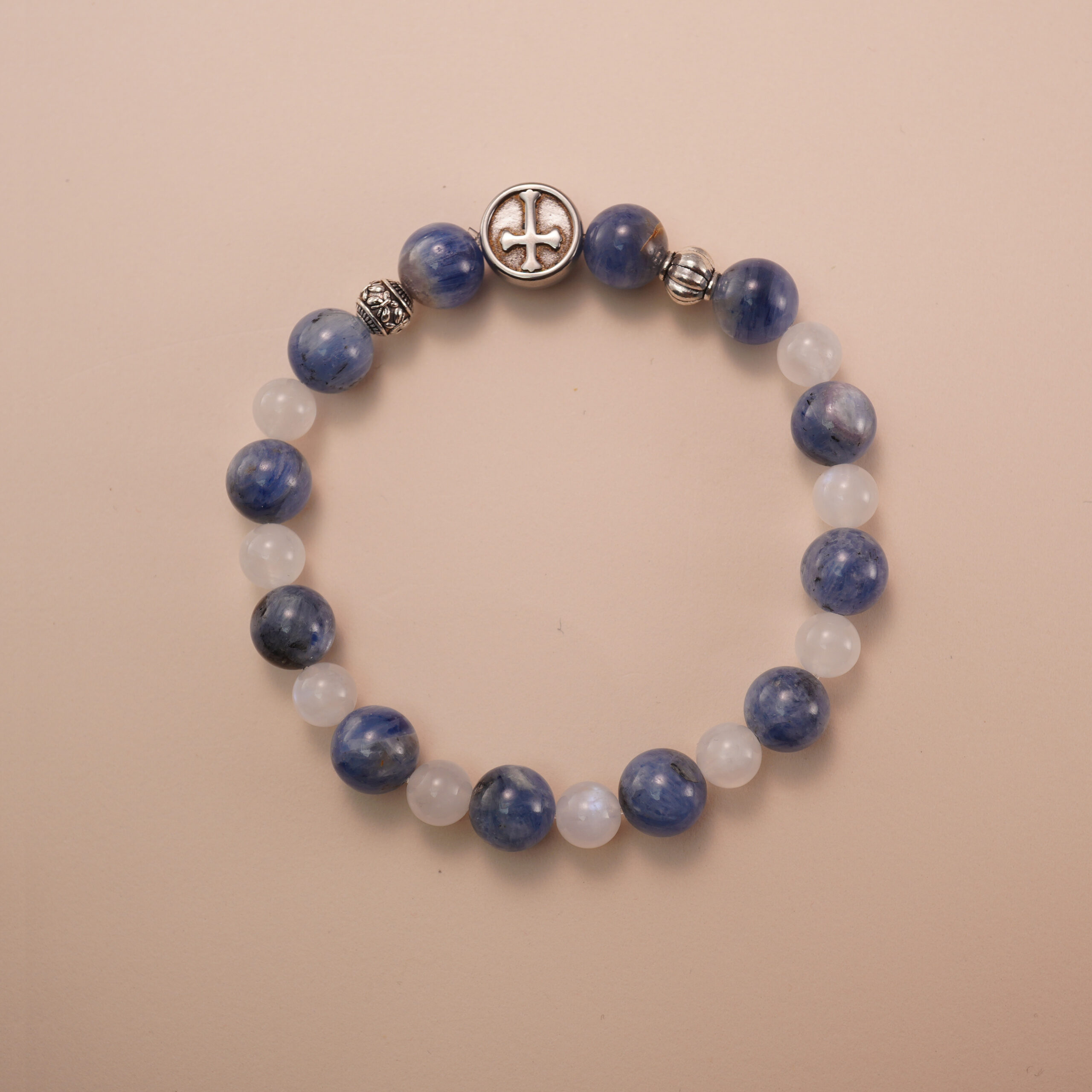 kyanite-moonstone-bracelet-with-silver-beads Kyanite and moonstone bracelet with silver accent beads, photographed under soft daylight on a neutral background.