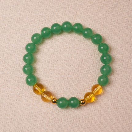 Green aventurine and citrine bracelet symbolizing wealth, good luck, and positive energy.