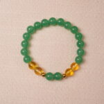 Green aventurine and citrine bracelet symbolizing wealth, good luck, and positive energy.