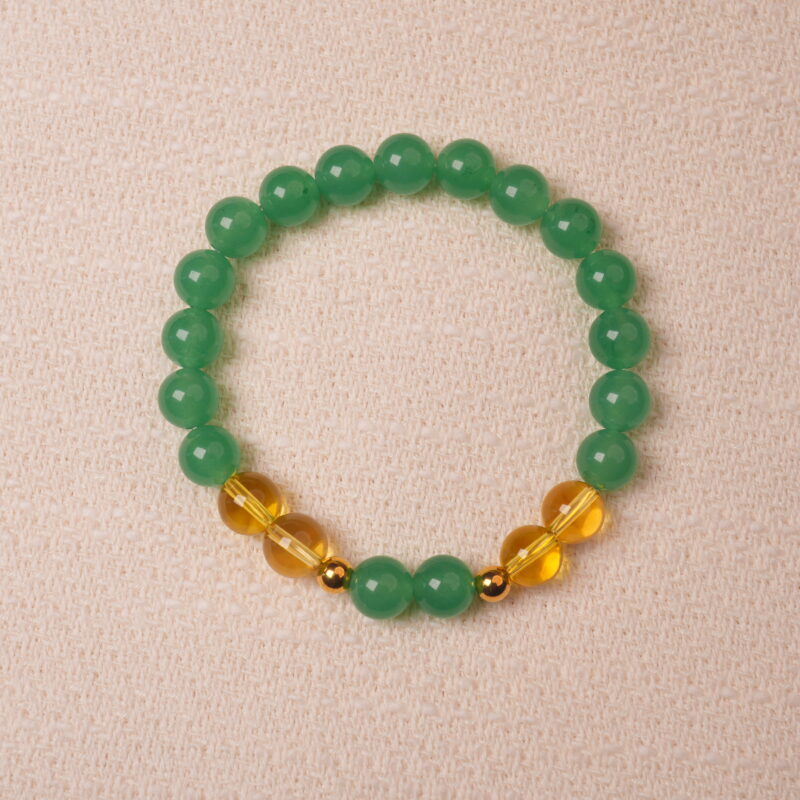 Green aventurine and citrine bracelet symbolizing wealth, good luck, and positive energy.