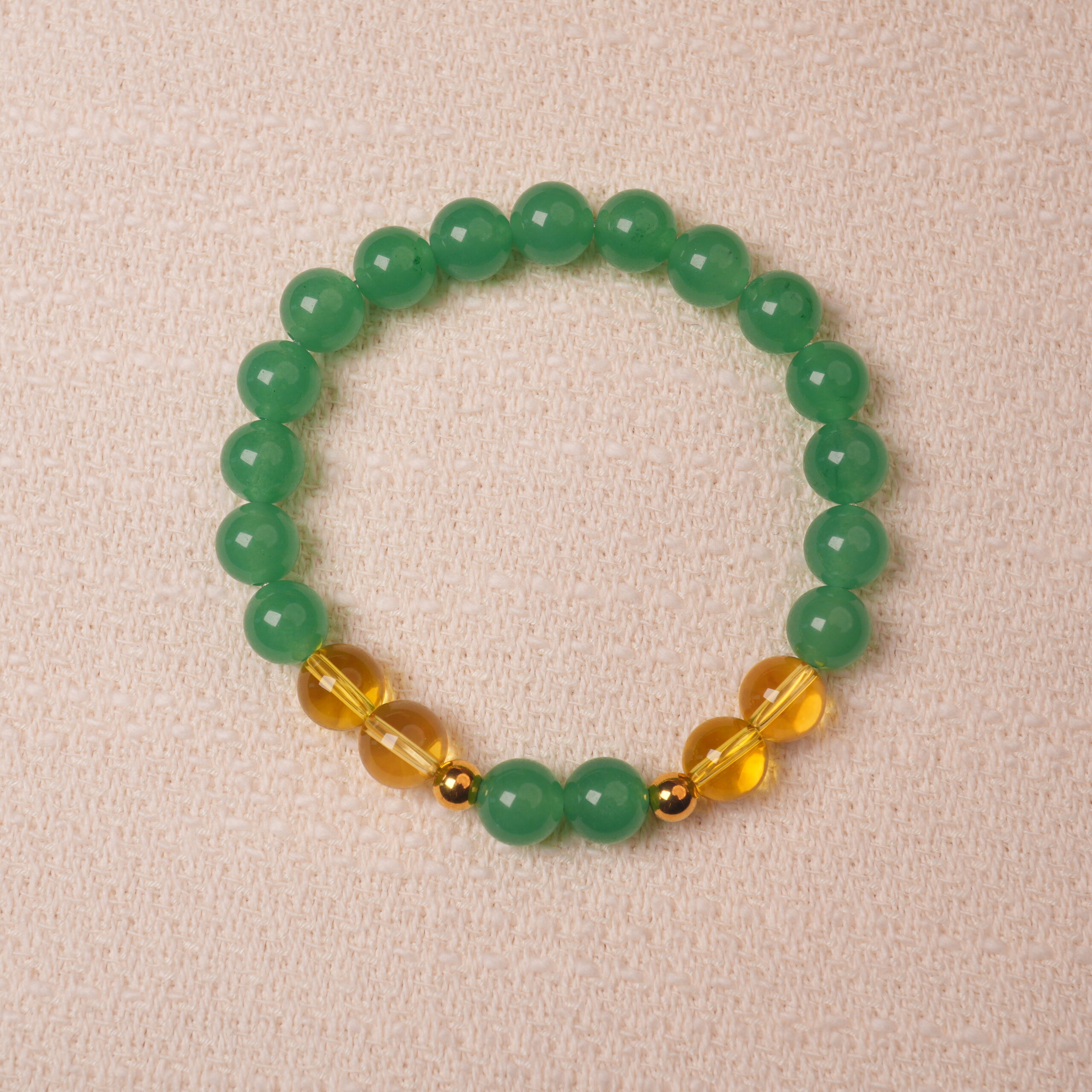 green-aventurine-citrine-bracelet-main.jpg Green aventurine and citrine bracelet symbolizing wealth, good luck, and positive energy.