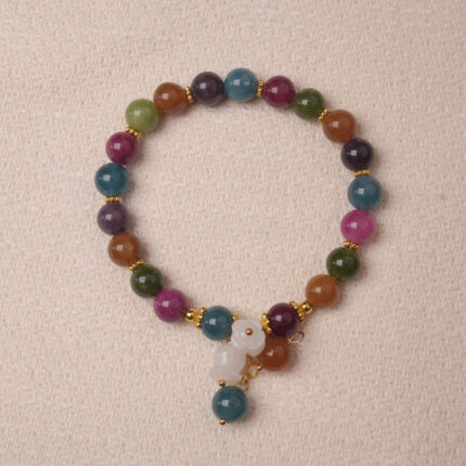 Multicolor tourmaline bracelet with white gourd charm, symbolizing protection, balance, and good luck energy.