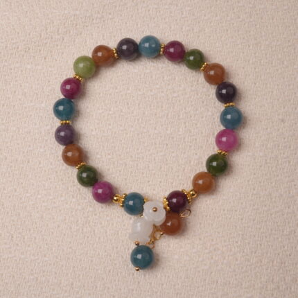 Multicolor tourmaline bracelet with white gourd charm, symbolizing protection, balance, and good luck energy.