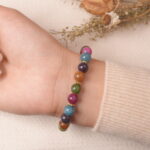 Back view of multicolor tourmaline bracelet, radiating colorful gemstone protection energy.