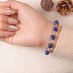 Back view of lapis lazuli and clear quartz bracelet, radiating soothing and confident energy.