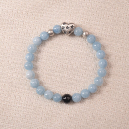 Aquamarine bracelet with silver heart charm and black accent bead, symbolizing calmness and clear communication.