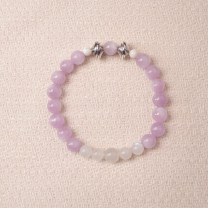 Kunzite and moonstone bracelet featuring soft lavender and milky white beads, symbolizing calm and emotional balance.