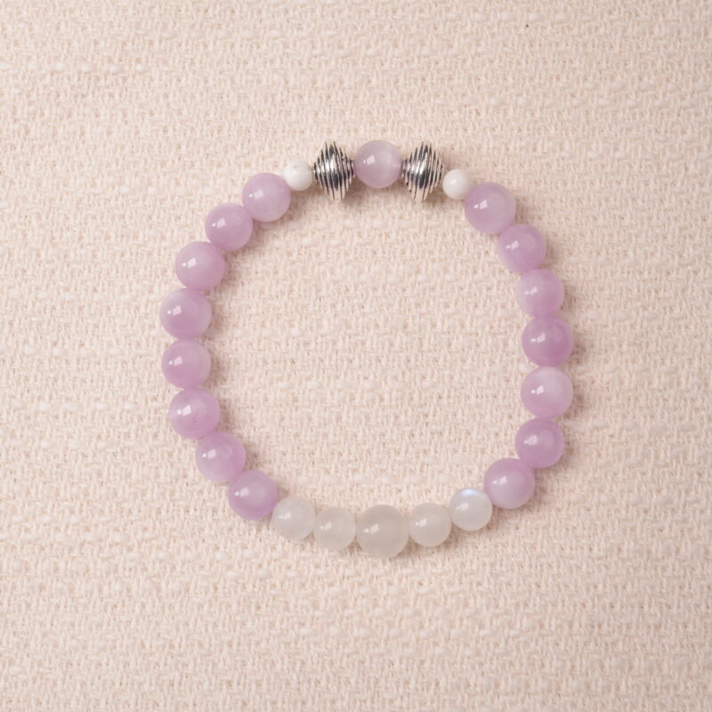 Kunzite and moonstone bracelet featuring soft lavender and milky white beads, symbolizing calm and emotional balance.