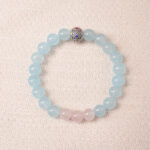 Aquamarine and rose quartz bracelet with blue and pink beads, symbolizing love, peace, and open communication.