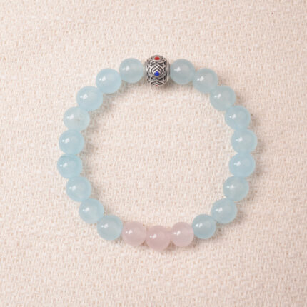 Aquamarine and rose quartz bracelet with blue and pink beads, symbolizing love, peace, and open communication.