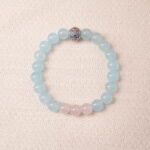 Aquamarine and rose quartz bracelet with blue and pink beads, symbolizing love, peace, and open communication.
