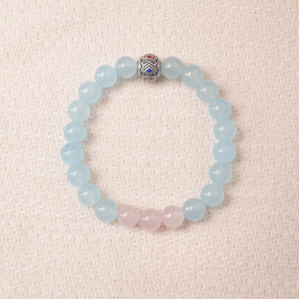 Aquamarine and rose quartz bracelet with blue and pink beads, symbolizing love, peace, and open communication.