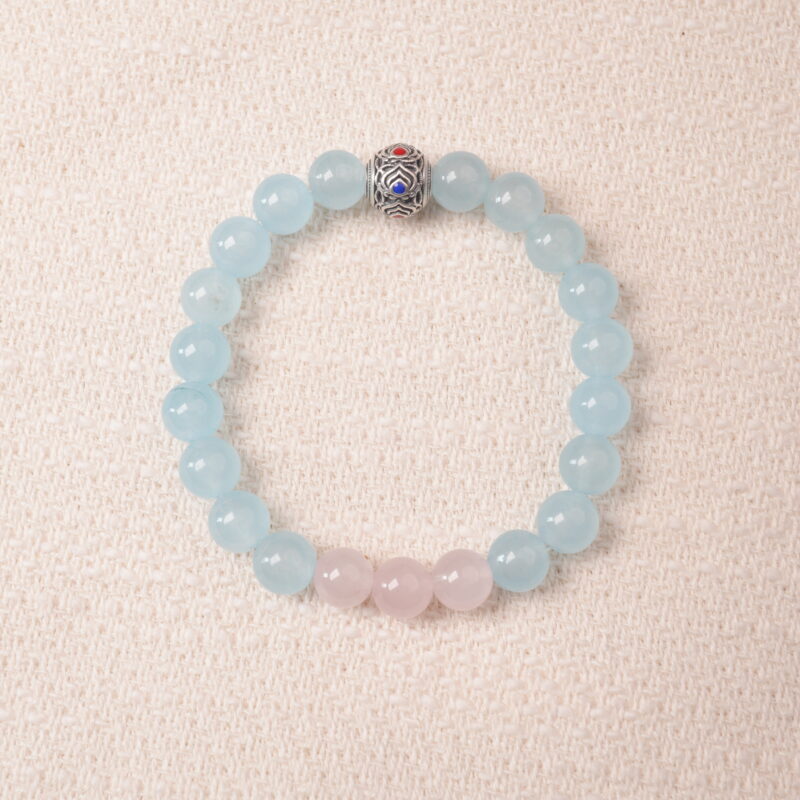 Aquamarine and rose quartz bracelet with blue and pink beads, symbolizing love, peace, and open communication.