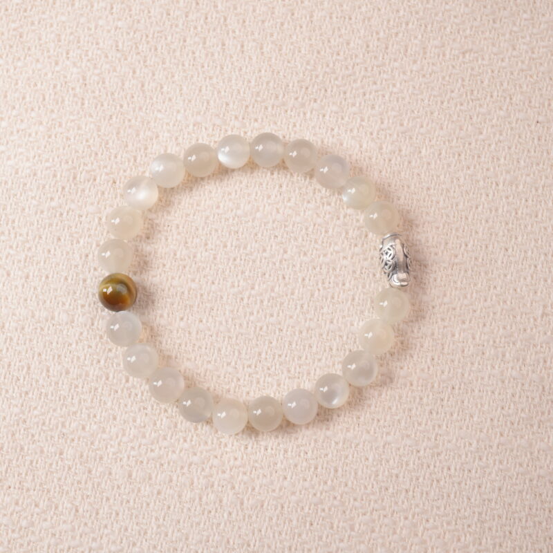 Moonstone bracelet with soft white shimmer, symbolizing calm energy and emotional balance.