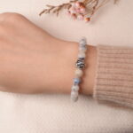 Model wearing jade energy bracelet, showcasing elegant natural shine and peaceful energy.