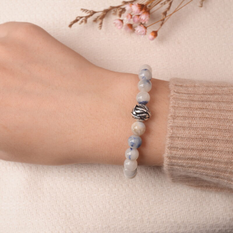 Model wearing jade energy bracelet, showcasing elegant natural shine and peaceful energy.