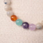 Close-up of jade energy bracelet showing smooth polish and delicate craftsmanship.