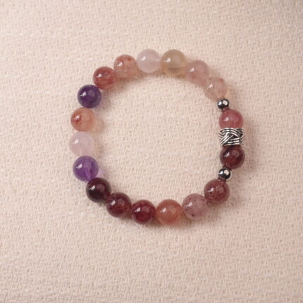 Strawberry quartz and amethyst bracelet with natural pink and purple tones, symbolizing love and positivity.