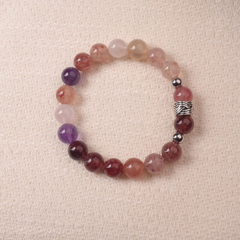 Strawberry quartz and amethyst bracelet with natural pink and purple tones, symbolizing love and positivity.