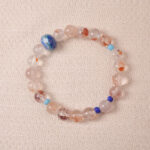 Red Hematoid Quartz bracelet featuring natural red inclusions within clear quartz, symbolizing grounding and passion.