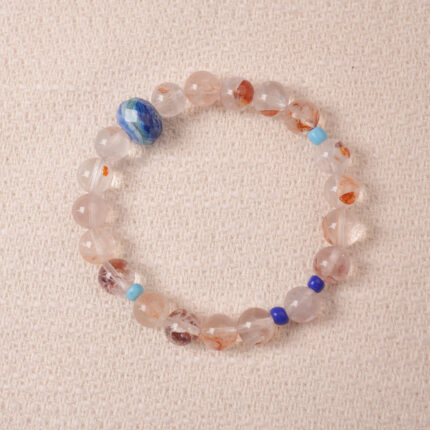 Red Hematoid Quartz bracelet featuring natural red inclusions within clear quartz, symbolizing grounding and passion.