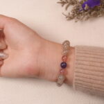 Back view of the Moonstone, Amethyst, and Strawberry Quartz bracelet with a close-up of the soothing pastel beads.