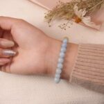 Back view of the Tranquil Harmony bracelet with a close-up of the soft pastel beads and silver accent.