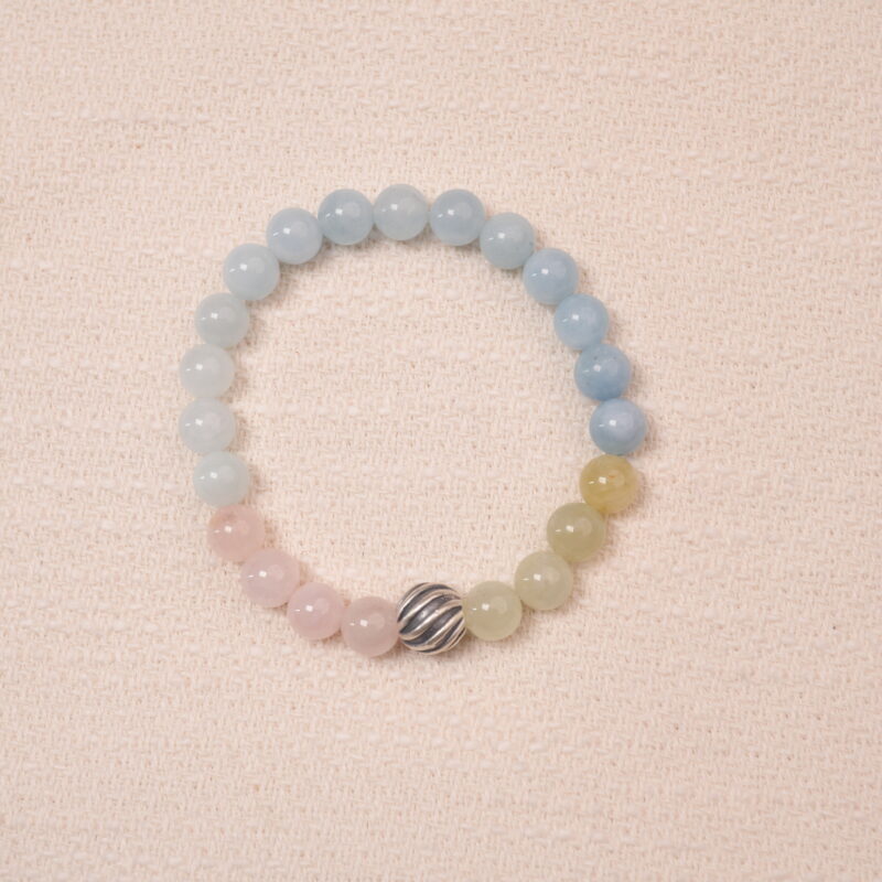 Tranquil Harmony bracelet with aquamarine, rose quartz, and green jade beads, featuring a silver accent bead in the center.