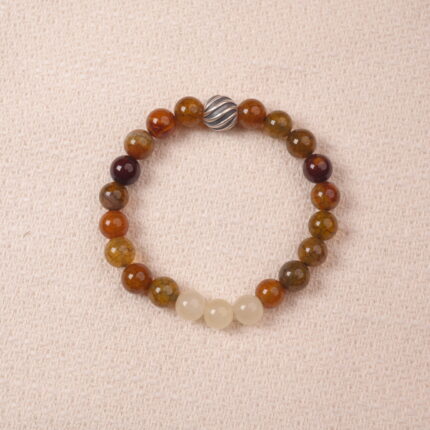 A close-up of a Yellow Chalcedony and White Chalcedony bracelet with smooth, polished beads in warm golden and soft white hues. The bracelet features a silver S925 spacer bead, adding elegance and contrast to the gemstones.