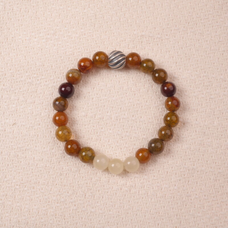 A close-up of a Yellow Chalcedony and White Chalcedony bracelet with smooth, polished beads in warm golden and soft white hues. The bracelet features a silver S925 spacer bead, adding elegance and contrast to the gemstones.