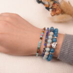 Model wearing the Ocean Whisper communication bracelet stack, enhancing self-expression and emotional balance.1