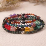 Detail close-up of multi-stone good luck bracelet stack, highlighting vibrant natural gemstone beads.