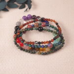 Flatlay of good luck mixed-crystal bracelet set with colorful natural stones for positivity and abundance.