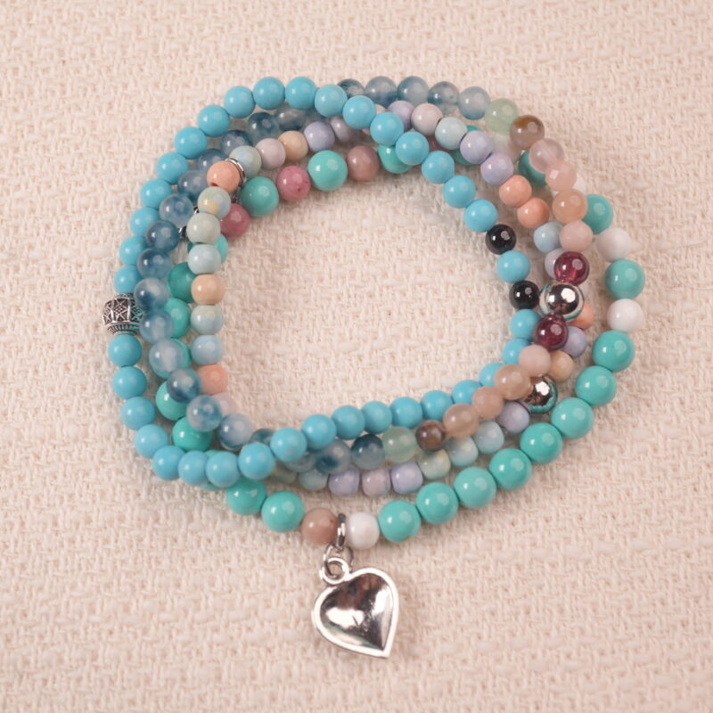 Good luck intention bracelet stack with turquoise tones, symbolizing positivity, protection, and fresh opportunities.