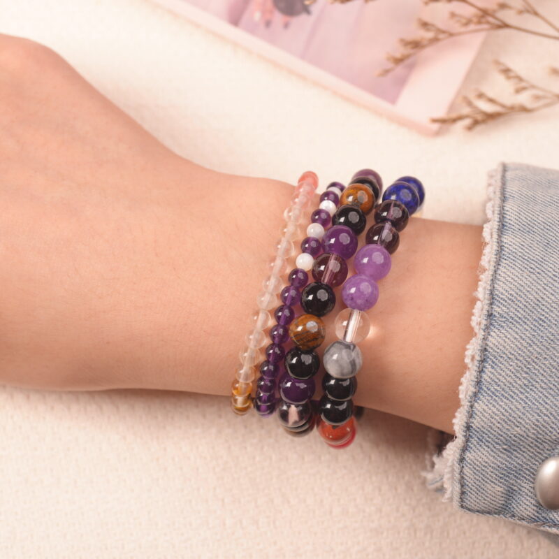 Model wearing the Rainbow Fortune bracelet stack — a daily charm for confidence, joy, and good luck.1